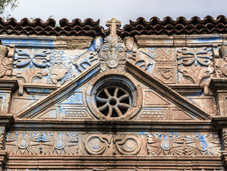 External portal of a church of Fuerteventura with Aztec symbols