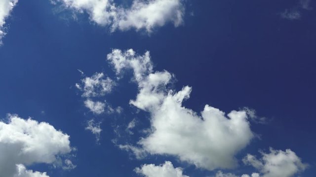 cinematic shot of blue cloudscape moving up