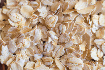 Oatmeal flakes for breakfast. Texture of cereals