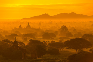 Beautiful silhouette landscape view of sunrise morning in Bagan, an ancient city located in the Mandalay Region of Myanmar.