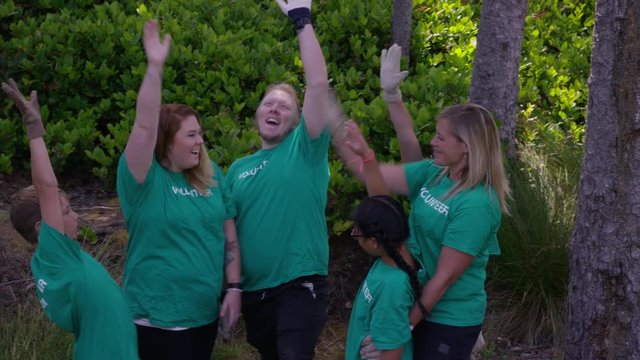 Group of volunteers cleaning up park