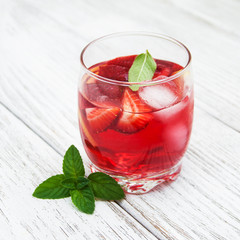 Glass of lemonade with strawberries