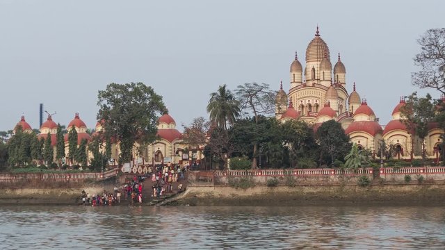Hindu Dakshineswar Kali temple at sunrise in Kolkata, india.  Time Lapse zoom.