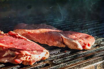 bbq beef steaks on hot grill