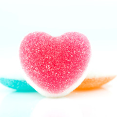 Obraz na płótnie Canvas Heart candies coated with sugar, heart colorful sweet candies, sugar heart shaped candy