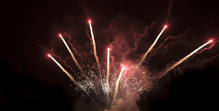 Amazing colorful fireworks on a night sky black background