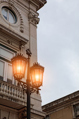 Fototapeta na wymiar Old street lamp in Lisbon, detail of an old lighting in the city.