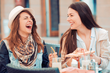 Girls eating pizza