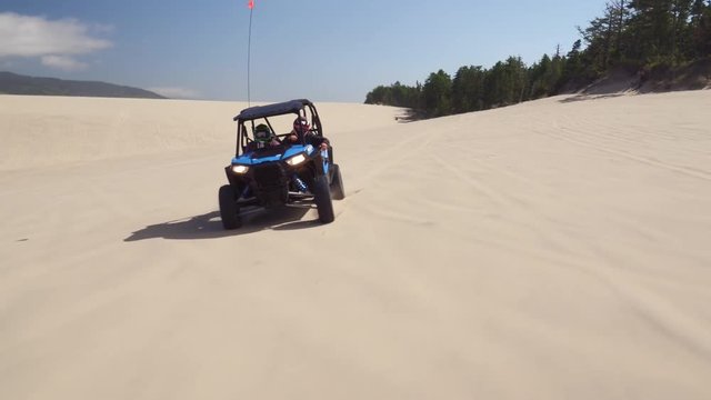 Aerial view of ATV driving on sand dunes, Oregon