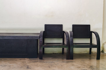 Wooden Chairs with Small Table Standing in The room.