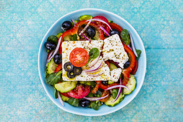 Choriatiki - Greek salad with feta cheese. Mediterranean food.  - obrazy, fototapety, plakaty
