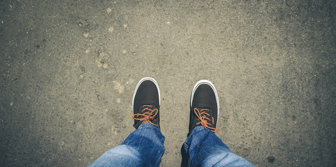Top view from Young man with sneakers and jeans