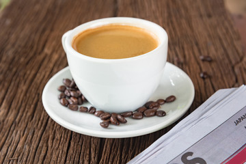 A cup of coffee and a newspaper