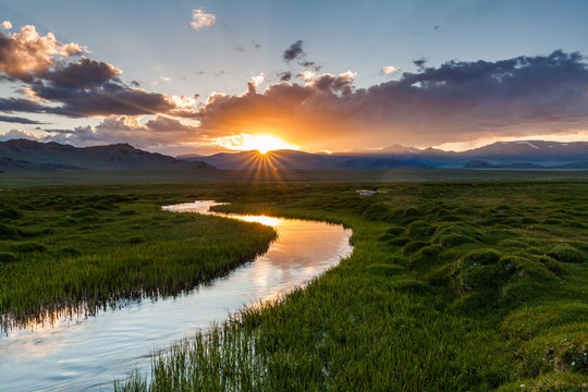 Fototapeta Beautiful sunset over the mountain river in summer