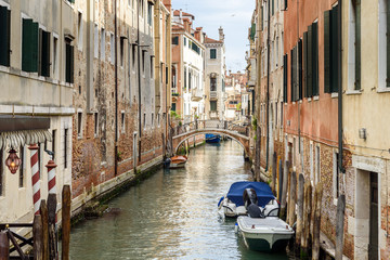 Fototapeta na wymiar urban view in Venice, italy, historic houses, boats and the canal