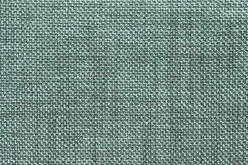 Dark green textile background with checkered pattern, closeup. Structure of the fabric macro.