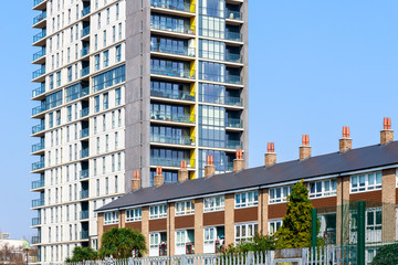 English traditional terraced houses in contrast to modern tower block flats