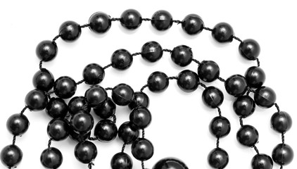 Fototapeta premium Black beads on a white background