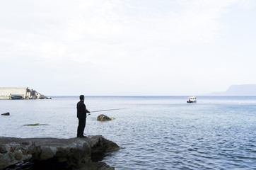 Fototapeta na wymiar fisherman. Scilla, Calabria, Italy