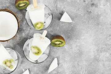 Ice cream from yogurt / coconut milk from kiwi on a light background. Top view, copy space. Food background