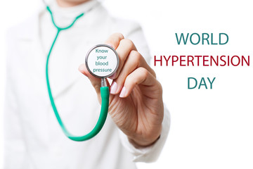 World Hypertension Day. Doctor holding stethoscope with text. Know your blood pressure. 17th May.