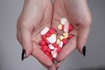pills in women's hands