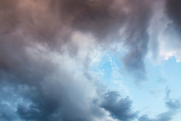 Beautiful clouds at sunset after rain as background .