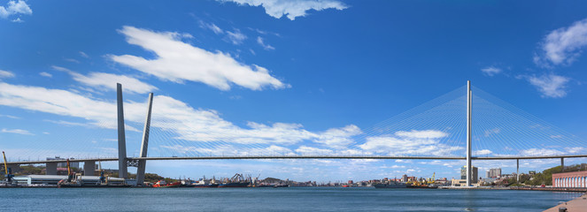 Panorama of the city of Vladivostok. View of the Golden Horn Bay and the Golden Bridge