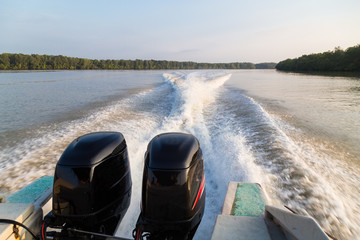 Wave generated by speed boat twin engine in river