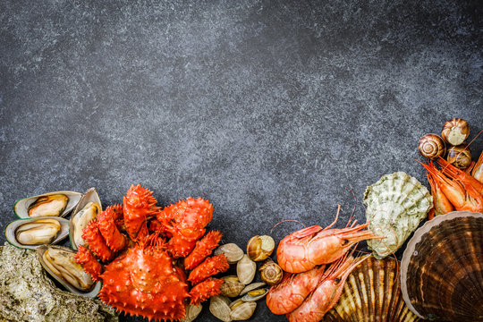 Seafood Cuisine Plate As An Ocean Gourmet Dinner Background. Crab, Seashells, Oysters And Other Seafood Delicacies.