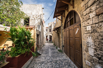 Fototapeta na wymiar Medieval arched street in the old town of Rhodes, Greece