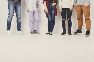 Diverse casual people standing in row indoor, crop