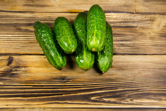 Fresh cucumbers on wooden table