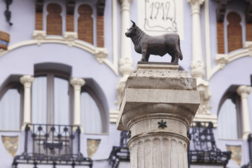 Torico bull sculpture and modernism facade in Teruel. Spain