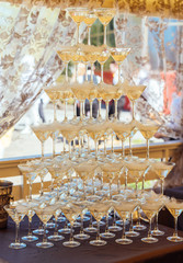 Pyramid of glasses champagne on wedding party. Champagne glass pyramid