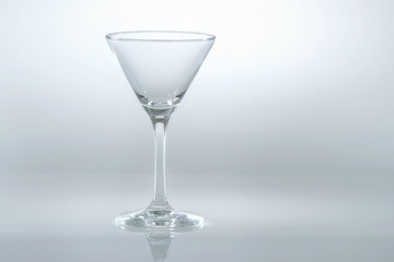 Blank glass of martini on white background