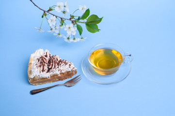 cake with tea on blue background
