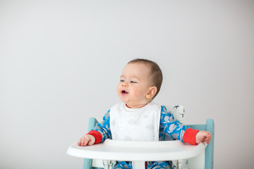 Baby watching cartoons on TV (6 months old).