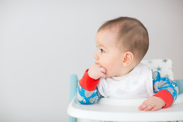 Baby watching cartoons on TV (6 months old).