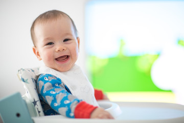 Baby watching cartoons on TV (6 months old).