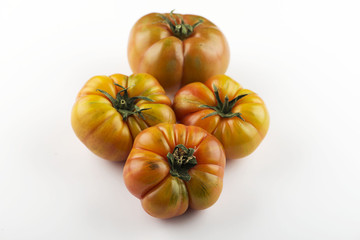 Three appetizing tomatoes on white background. Isolated. Healthy food.