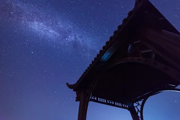 Fototapeten The silhouette of Chinese architecture under the dark night sky. Pavilion © snvv
