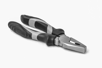 Obraz premium Black and red metal pliers isolated on white