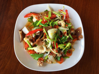 Spicy mix seafood and vegetable in white plate