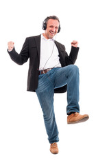 Happy man listening music and dancing