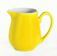 Yellow ceramic milk jar isolated on white