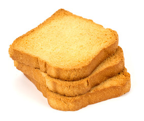 still life of golden rusk in a white background