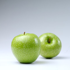 Green apples on a white background