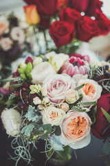 Obraz na płótnie Canvas Roses in a brides flower bouquet