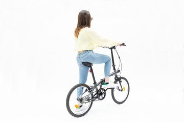 Young girl on collapsible bike